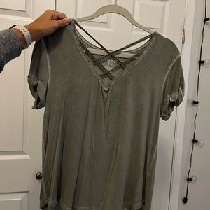 American eagle army green short sleeve tee with lace cross cross at neck.